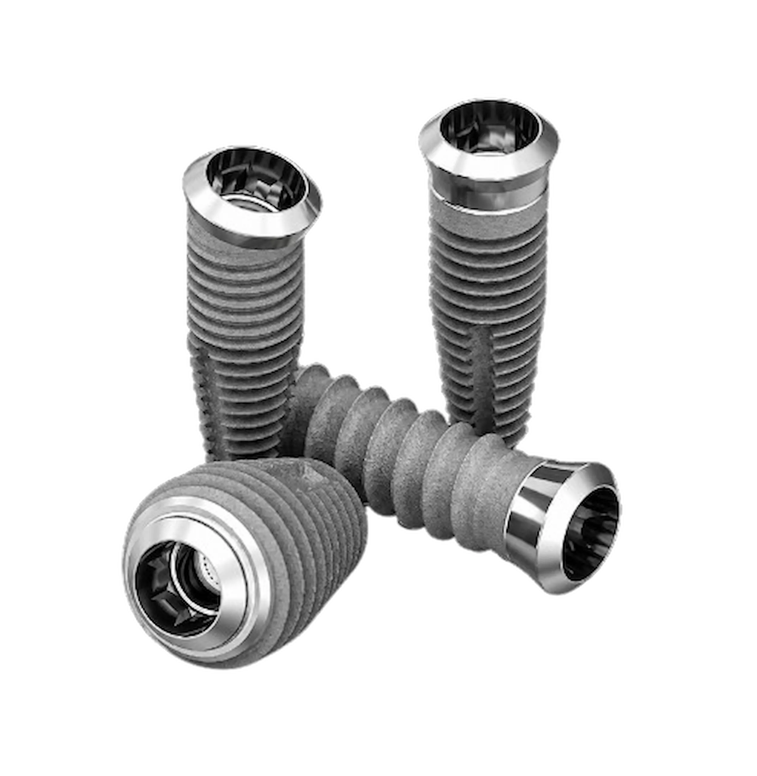 Implants dentaires en métal sur fond noir.